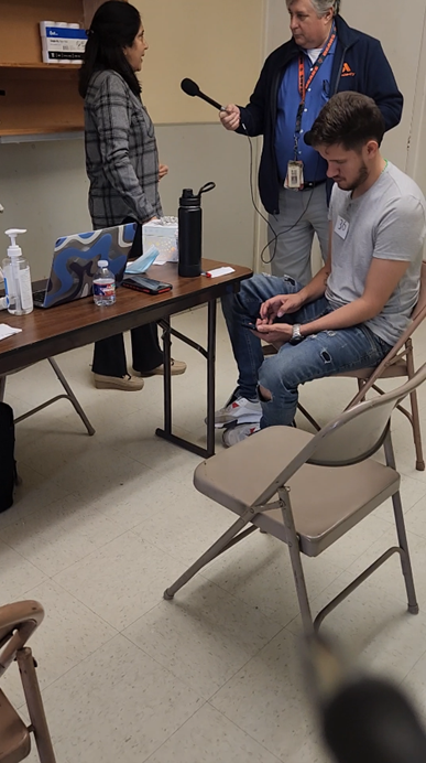 Friendly-media-interviewing-volunteers-Image-via-Brian-Armstrong-Copy.png